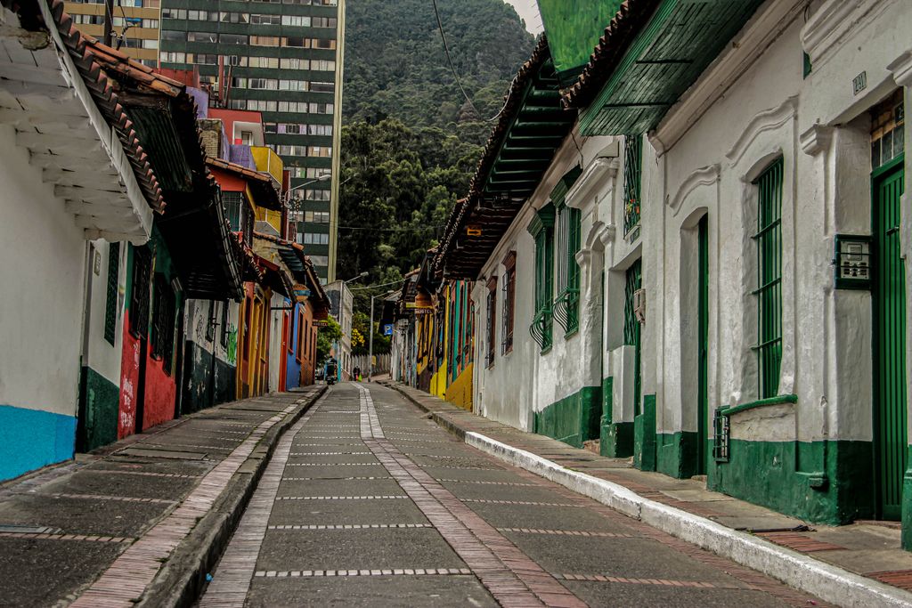 Vibrant colonial houses line a quaint street in La Candelaria, Bogota, Colombia.