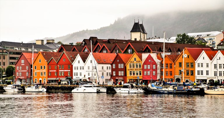 Charming waterfront of Bergen showcasing vibrant historic buildings and boats. Things to do in Bergen Norway